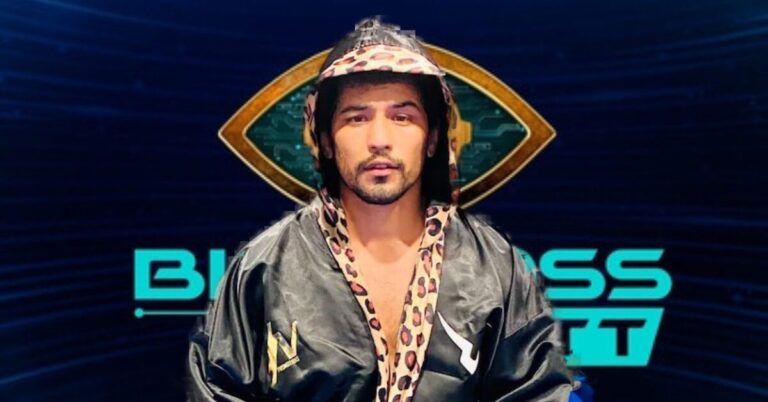 A man with a beard wearing a black jacket, identified as Niraj Goel from Bigg Boss OTT.